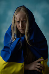 A real Ukrainian blonde woman is upset by evil and disappointed during the war with the state...