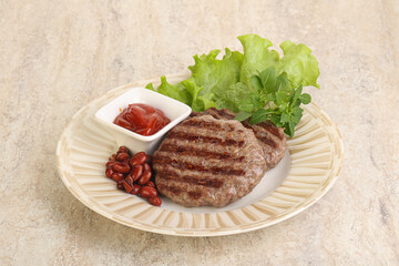 Grilled beef burger cutlet with sauce