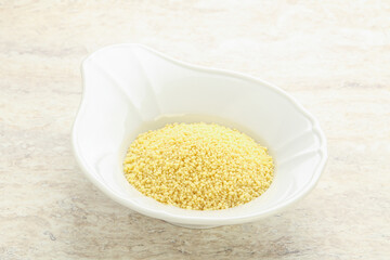 Raw couscous in the bowl