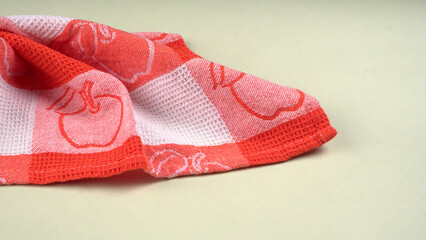 Folded kitchen textile towels of different colors, Household cleaning cloth. Closeup of cleaning rag isolated on a white background.
