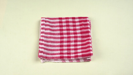 Folded kitchen textile towels of different colors, Household cleaning cloth. Closeup of cleaning rag isolated on a white background.
