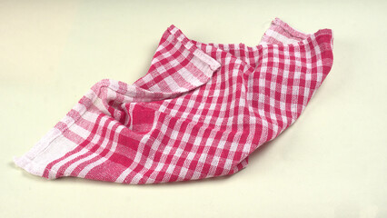 Folded kitchen textile towels of different colors, Household cleaning cloth. Closeup of cleaning rag isolated on a white background.
