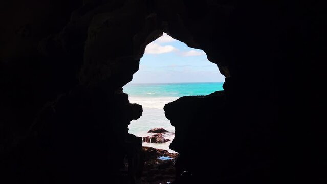 Sea view from the inside of a dark cave
