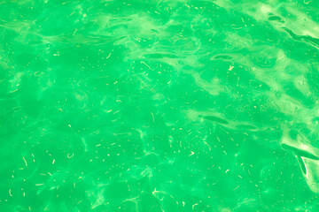 Bright green acid slime, texture unusual liquid transparent material, background texture