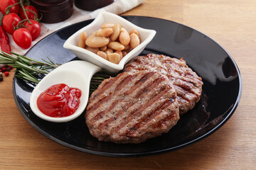 Grilled beef burger cutlet with sauce
