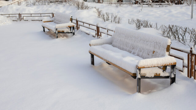 Snow-covered Bench Sunk Large Amount Of Precipitation In Winter, Snowfall In The City