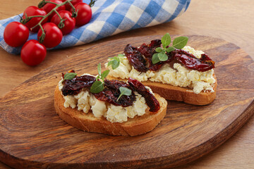 Bruschetta with soft cheese and tomato