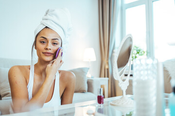 Young woman massaging her face. Daily facial skincare treatment, anti age procedures for better moisturising, lymphatic drainage, skin tone improve and wrinkles reducing