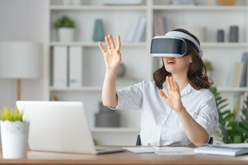 Woman with VR virtual reality goggles