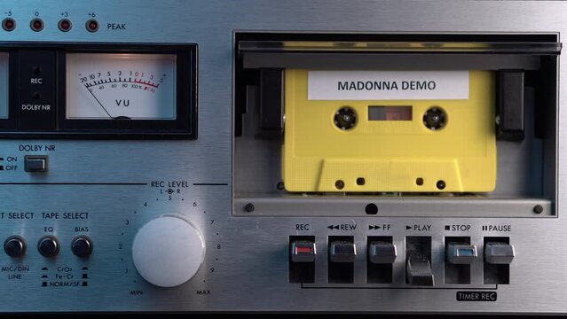 Audio Cassette Tape With Madonna Demo Songs From 1980s, Hand Placing Tape in Deck and Pressing Play, Close Up