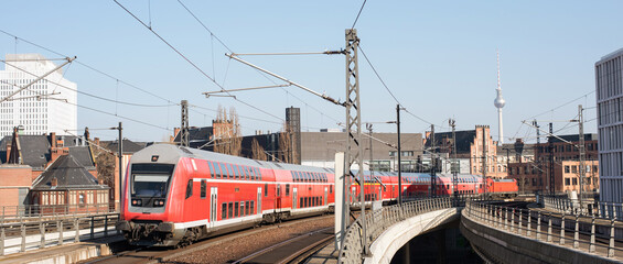 Berlin city center with train on a track panoramic banner, Berlin railway station, Transportation...