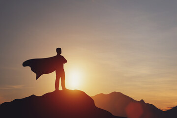 silhouette of superhero businessman on hill Sky with bright sunlight. Successful business ideas, outstanding leadership skills. achievements and goals