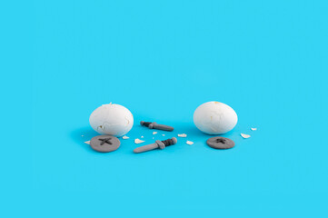 Easter concept with eggs fighting with swords and shields on pastel blue background