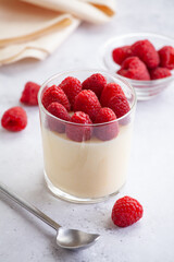 Homemade sweet panna cotta with organic raspberries