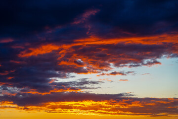 Naklejka na ściany i meble dramatic summer evening orange sky, bright colorful sunset
