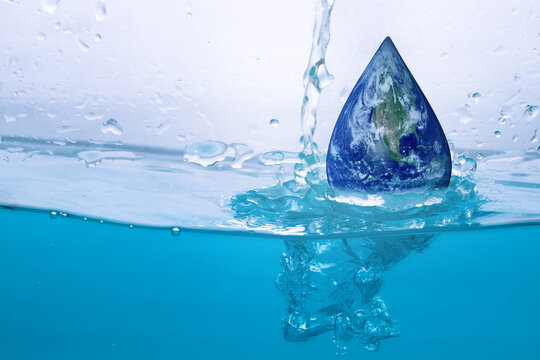 World Water Day Concept. earth in drop shape. Environmental protection, energy saving of the earth, Tree planting, Bluewater bubble background.Elements of this image furnished by NASA
