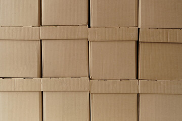 Set of cardboard brown boxes in storehouse. Background of carton boxes in wsrehouse
