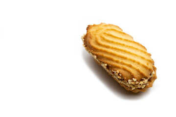 Cookies on a white background with cream and nuts.