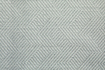 Knitted texture. Texture of jacquard fabric with gray blue geometric pattern. Crochet mosaic pattern.