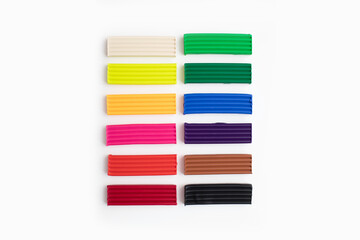 Set of colorful plasticine sticks isolated on white background. Pieces of multicolor plasticine...