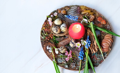 Wiccan Altar for spring Ostara sabbat. wheel of the year with candle, flowers, feathers and eggs. Esoteric Ritual for pagan holiday. Magical Spring equinox - obrazy, fototapety, plakaty