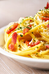 Traditional italian dish spaghetti carbonara with bacon in a cream sauce