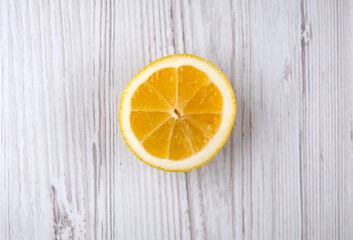 Fototapeta na wymiar Half a lemon on a wooden table. Citrus. Fruit. Healthy food