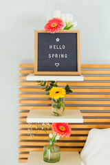Welcome spring sign with vintage chalkboard on wooden headboard