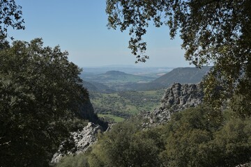 Panoramic view from Salto del Cabrero trail near Benaocaz, Spain, into the spring green foothills...