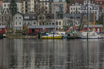 Fototapeta na wymiar Nov 16 2021, Flensburg light boats harbor.Here are sailboats in all colors.