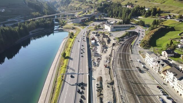 Drone view at cars in queue waiting to enter the Gotthard motorway tunnel of Airolo in Switzerland 