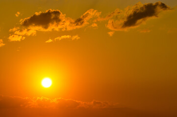 Fototapeta na wymiar Orange sunrise in sky.