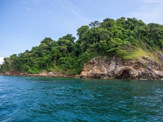 The green island in the beautiful blue sea and clear sky.