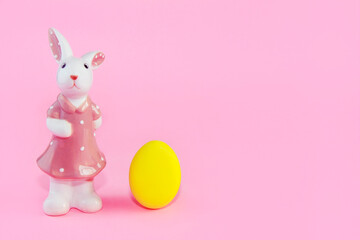 yellow easter egg and ceramic bunny