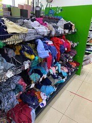 St. Petersburg, Russia, 03/11/2022, a local supermarket, clothes randomly laid out on the shelves of the store. Default, rising prices, local goods, consumption