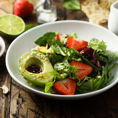 Healthy leaf salad with strawberry and avocado