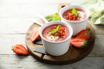 Homemade strawberry soup with chocolate and cream