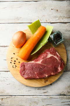 Beef Broth Ingredients On A Wooden Desk