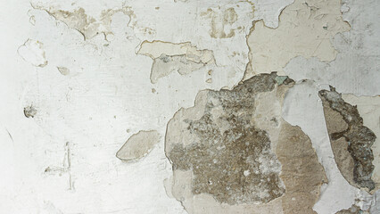 white old wall with cracked paint, texture, building destruction,selective focus