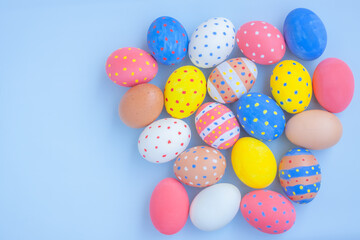 Fototapeta na wymiar Colorful easter eggs on blue background