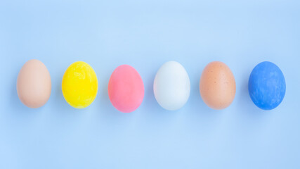 Colorful eggs on blue background
