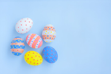Colorful easter eggs on blue background