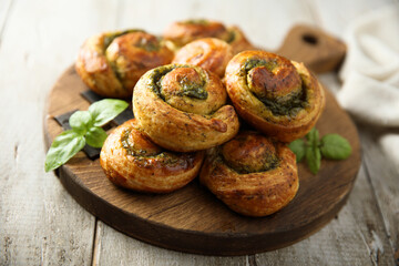 Homemade pastry rolls with pesto sauce