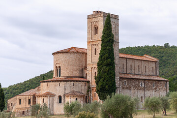 Fototapeta na wymiar Close view of San Antimo abbey (Abbazia di Sant'Antimo), a combination of different architectural styles and eras. Tuscany, Val d'Orcia, Italy