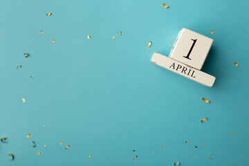 April 1st. Image of april 1 wooden calendar on blue background. Spring day, empty space for text....