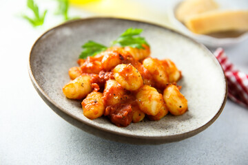 Homemade gnocchi with tomato sauce and cheese