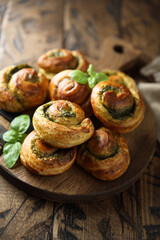 Homemade pastry rolls with pesto sauce