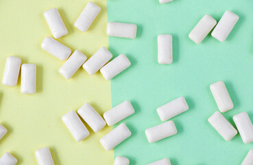 White chewing gums on the yellow and green background