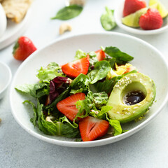 Healthy leaf salad with strawberry and avocado