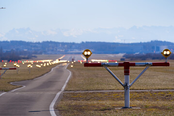 Runway with positioning spotlights at runway of the Zürich Airport on a sunny winter day. Photo taken February 27th, 2022, Zurich, Switzerland.
